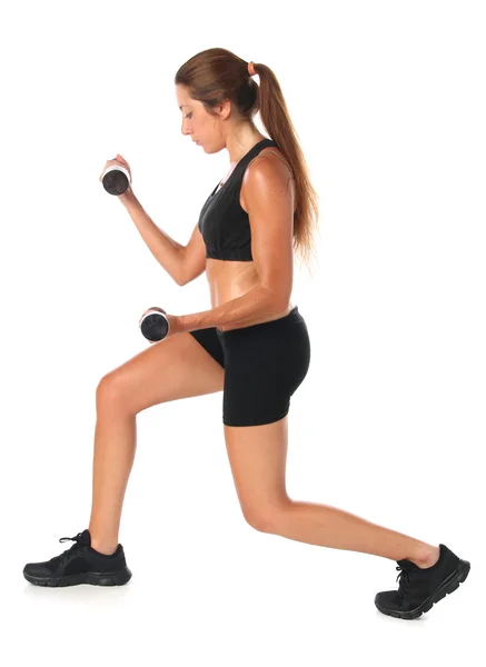 Young woman exercising with dumbbells — Stock Photo, Image