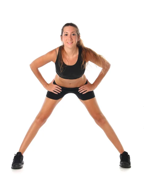 Happy young woman holding doing exercise and stretching — Stock Photo, Image