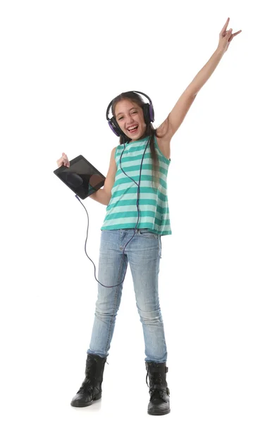 Beautiful pre-teen girl with a tablet computer. — Stock Photo, Image