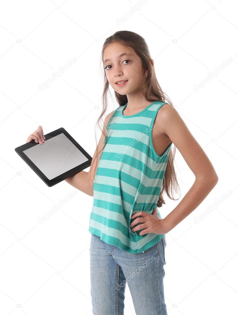 Beautiful pre-teen girl with a tablet computer.