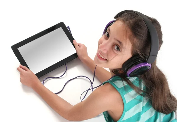 Beautiful pre-teen girl on the floor, using a tablet computer — Stock Photo, Image