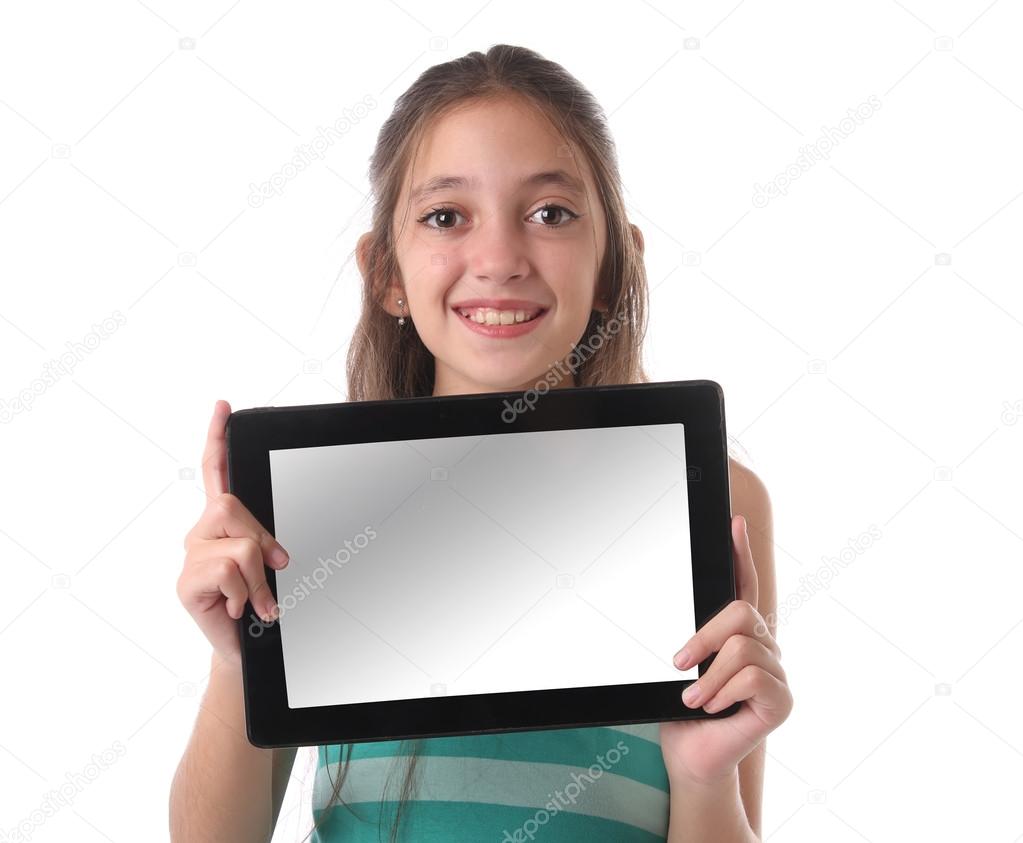 Beautiful pre-teen girl with a tablet computer. Isolated.
