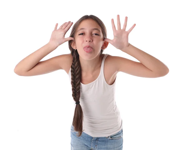 Menina fazendo uma piada wiyh uma cara engraçada . — Fotografia de Stock