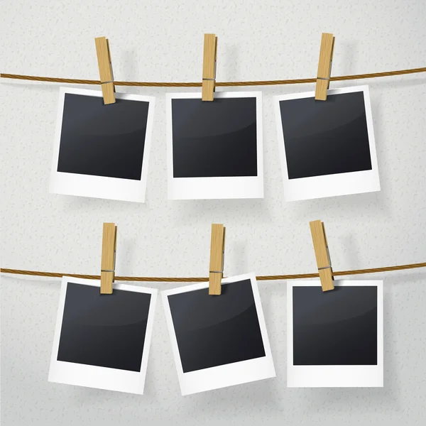 Blank photo frames on rope — Stock Vector