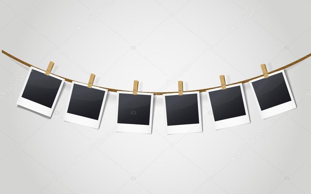 blank photo frames on a clothesline 