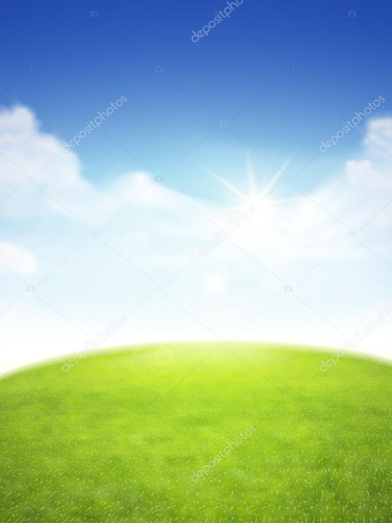 blue sky and field of green grass