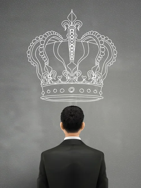 Бізнесмен з гігантською короною над головою — стоковий вектор