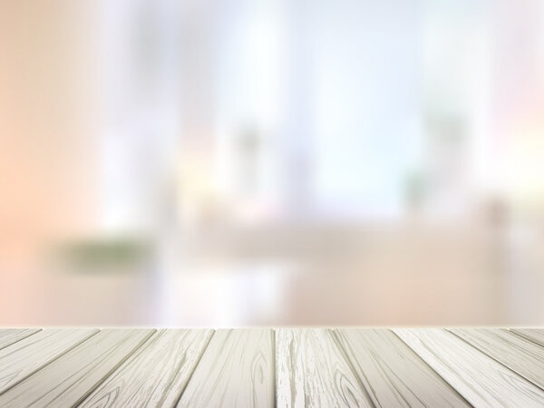 wooden desk over blurred interior scene