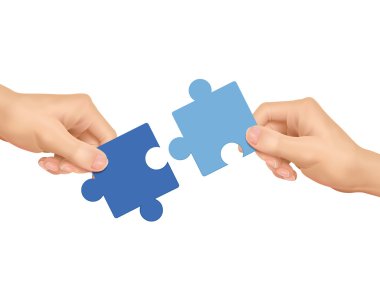 cooperation concept: hands holding jigsaw pieces  clipart