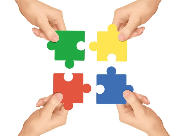 Cooperation concept: hands holding jigsaw pieces — Stock Vector