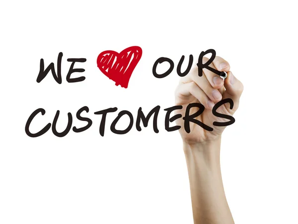 Nós amamos nossos clientes palavras escritas à mão — Fotografia de Stock
