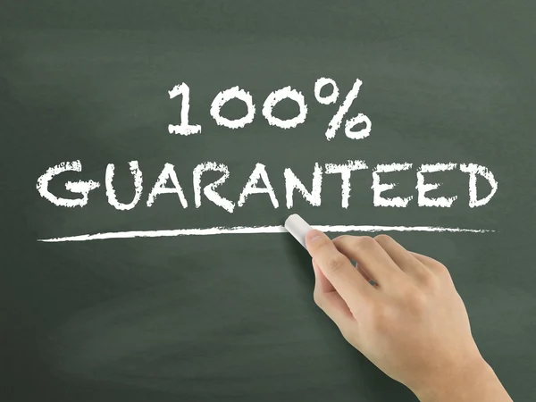 100 percent guaranteed words written by hand — Stock Photo, Image
