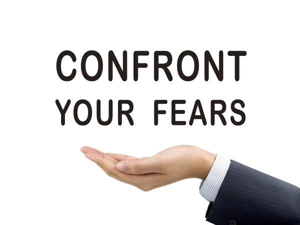 Confront your fears words holding by businessman's hand — Stock Photo, Image