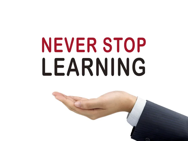 Sluta aldrig lära sig ord hålla businessman's hand — Stockfoto