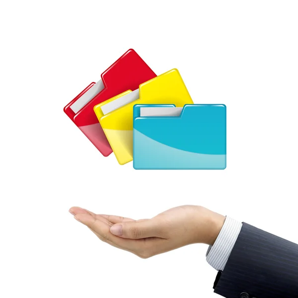 Biznesmen z ręki trzymającej kolorowe foldery — Zdjęcie stockowe