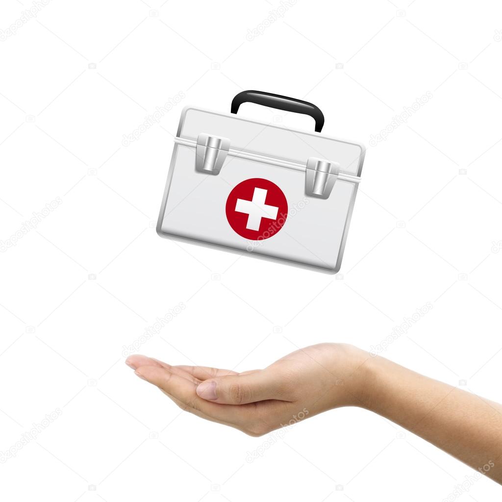 businessman's hand holding first aid kit 