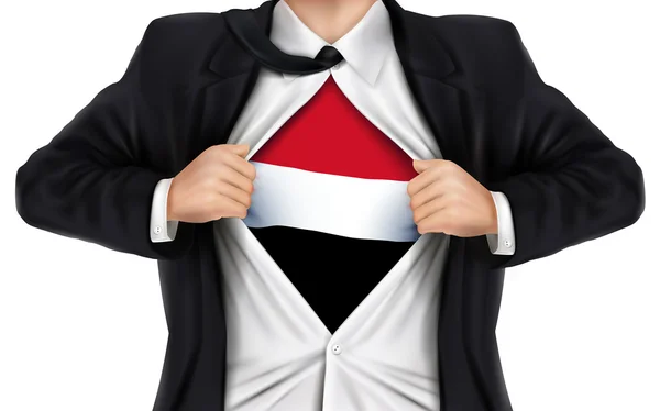 Hombre de negocios mostrando la bandera de Yemen debajo de su camisa — Vector de stock