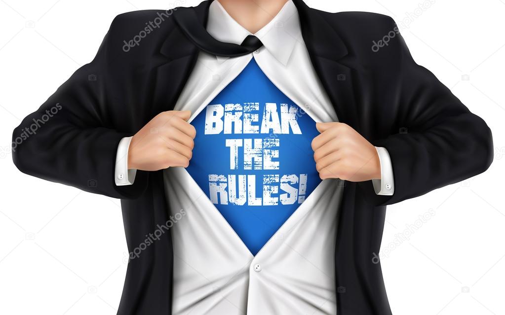 businessman showing Break the rules words underneath his shirt