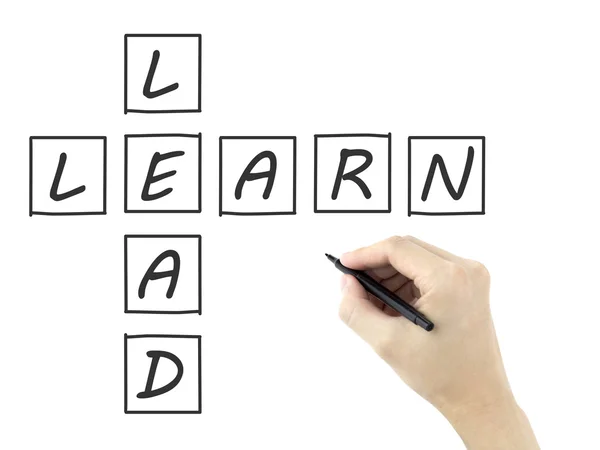 Learn-lead crossword written by man's hand — Stock Photo, Image