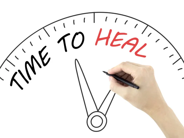 Time to heal written by man's hand — Stock Photo, Image