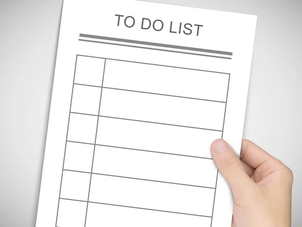 Business concept: man 's hand holding to do list — стоковое фото