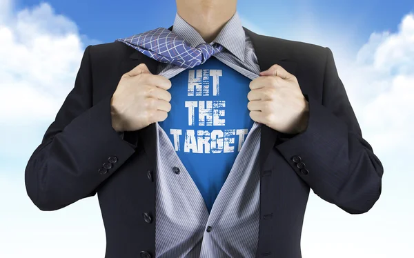 Businessman showing Hit the target words underneath his shirt — Stock Photo, Image