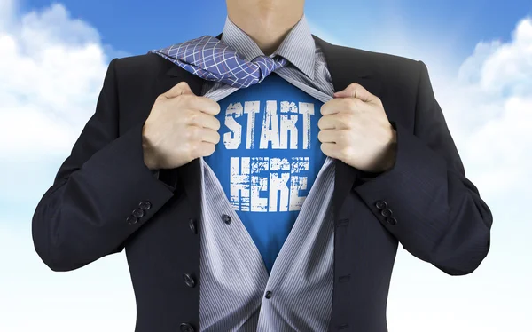 Businessman showing Start here words underneath his shirt — Stock Photo, Image