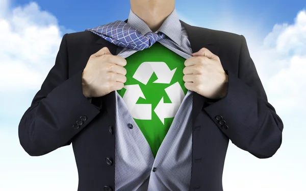 Businessman showing recycle icon underneath his shirt — Stock Photo, Image