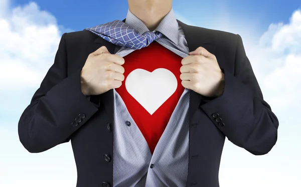 Homem de negócios mostrando ícone do coração sob sua camisa — Fotografia de Stock