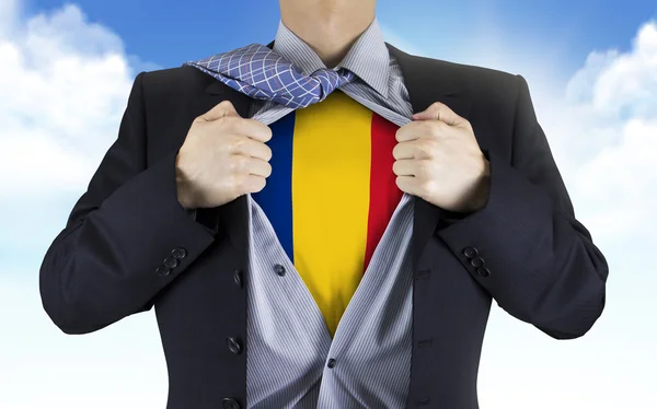 Businessman showing Romania flag underneath his shirt — Stock Photo, Image