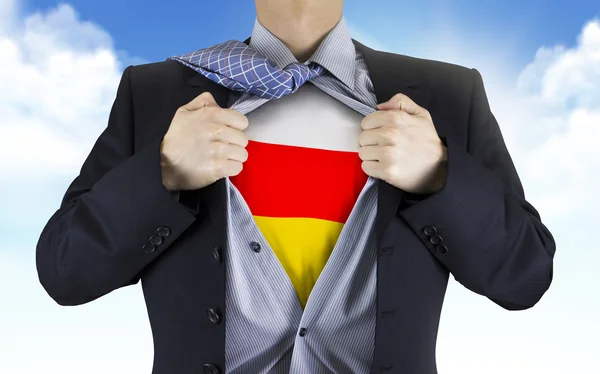 Businessman showing South Ossetia flag underneath his shirt — Stock Photo, Image