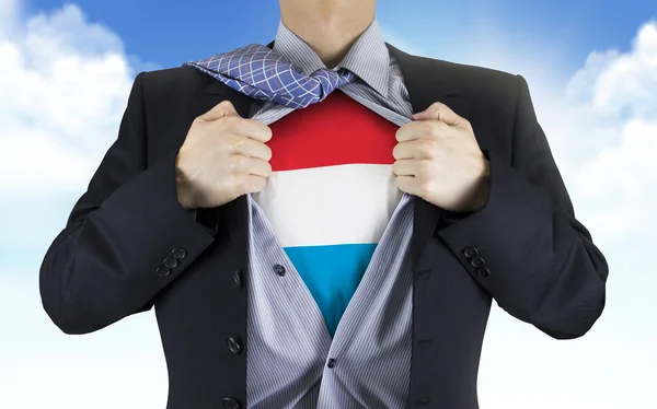 Podnikatel, ukazující Lucembursko vlajky pod košili — Stock fotografie