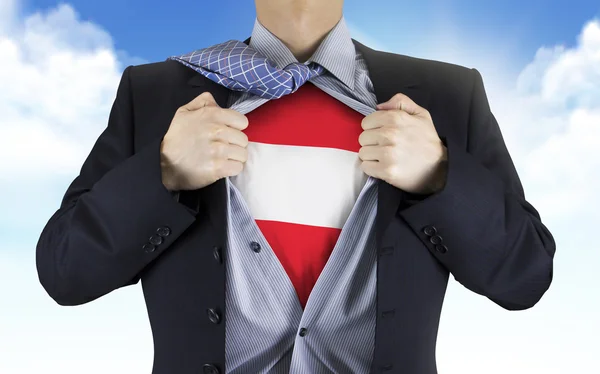 Businessman showing Austria flag underneath his shirt — Stock Photo, Image