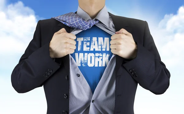 Businessman showing Teamwork word underneath his shirt — Stock Photo, Image