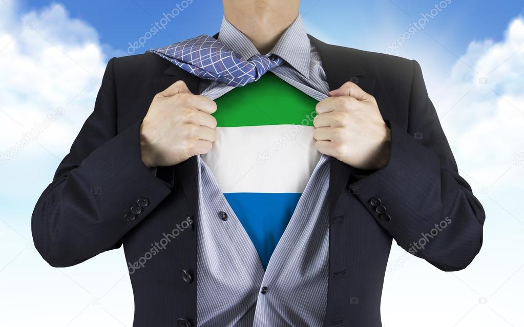 businessman showing Sierra Leone flag underneath his shirt