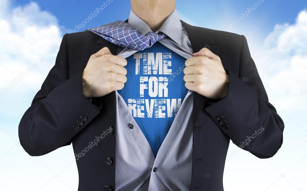 businessman showing Time for review words underneath his shirt