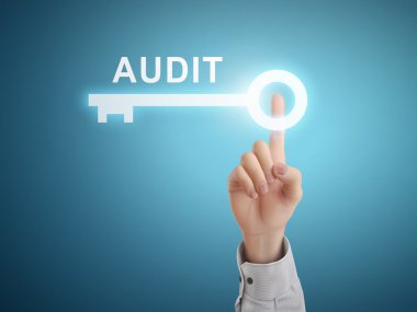 male hand pressing audit key button