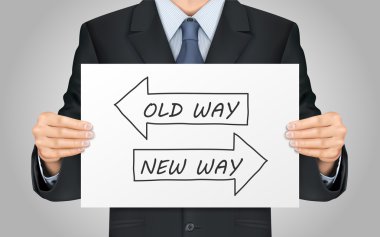 businessman holding old way or new way poster clipart