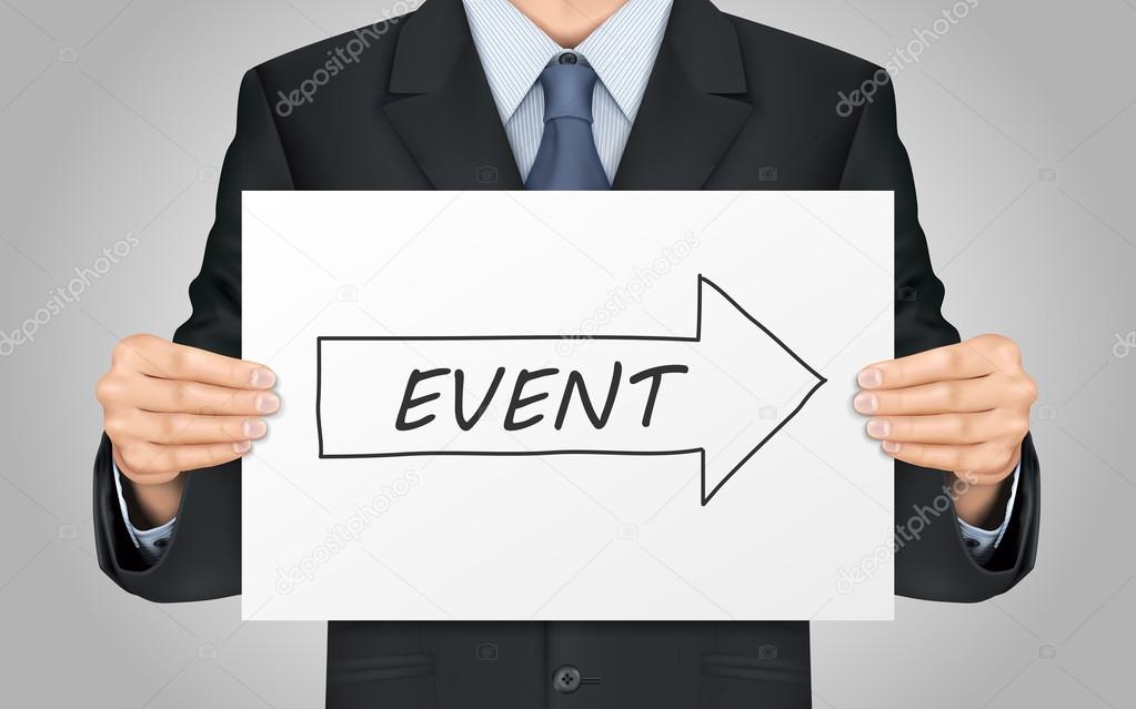 businessman holding event poster
