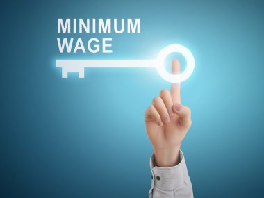 male hand pressing minimum wage key button  clipart