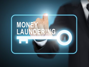 male hand pressing money laundering key button  clipart