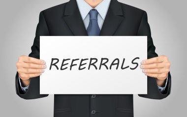 businessman holding referrals word poster clipart