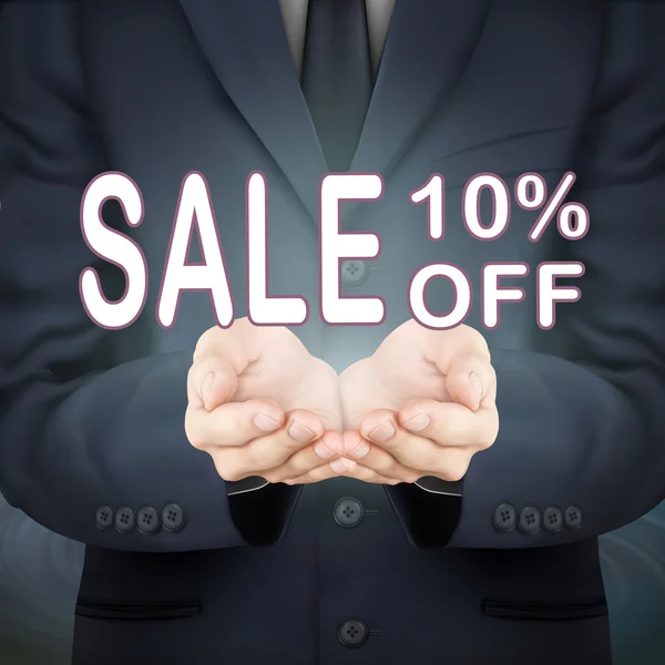 Affärsman holding försäljning 10 procents rabatt på ord — Stock vektor