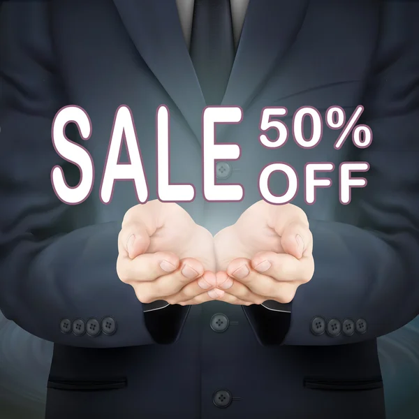 Επιχειρηματίας που κατέχουν πώληση 50 τοις εκατό off λέξεις — Διανυσματικό Αρχείο