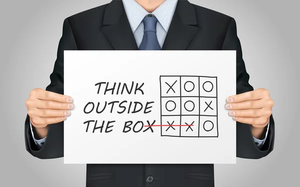 Podnikatel drží myslet mimo krabici plakát — Stockový vektor