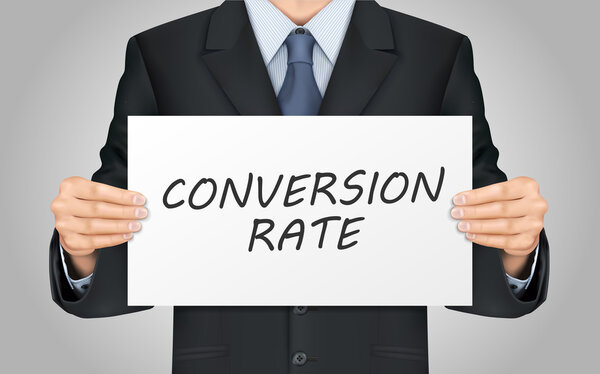 businessman holding conversion rate words poster