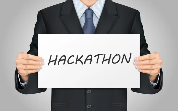 Hackathon kelime poster tutan işadamı — Stok Vektör