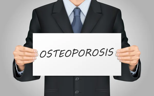 Hombre de negocios sosteniendo cartel osteoporosis — Archivo Imágenes Vectoriales