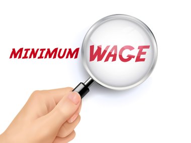 minimum wage words showing through magnifying glass  clipart
