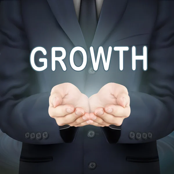Empresario sosteniendo palabra de crecimiento — Vector de stock
